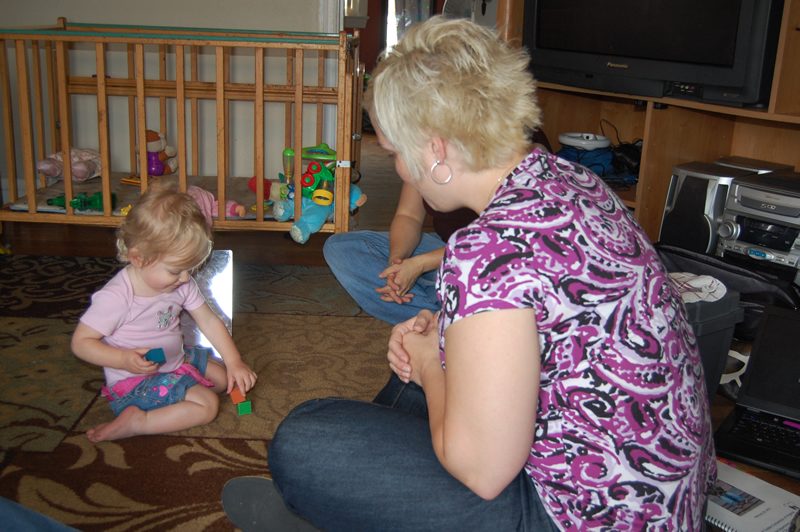 Early Intervention professional with child in their home environment